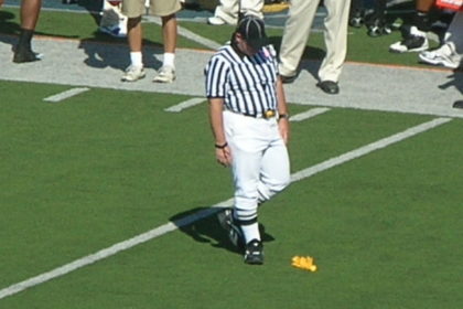 Official_picks_up_flag_at_UCLA_at_Cal_10-25-08