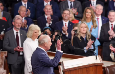king charles and camilla waving to congress